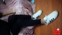 Chinese Girl gives a Nice Wrap up to her Hurt Foot while Wearing Leggings